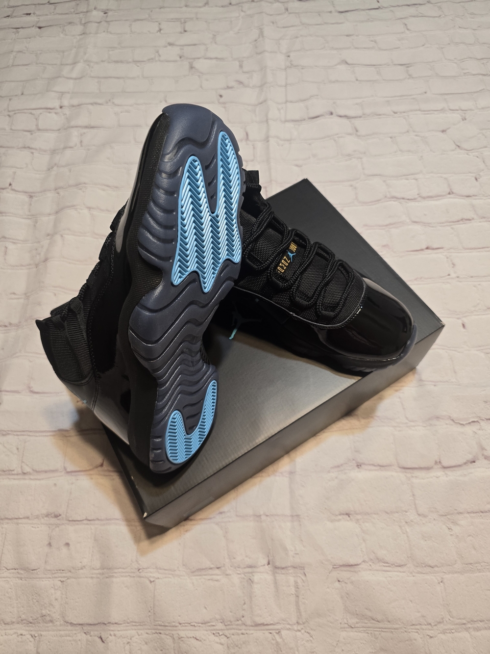 Jordan "Gamma" 11s Men's Black Sneakers with Light Blue Outsole Accents